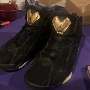 Black and gold Jordans